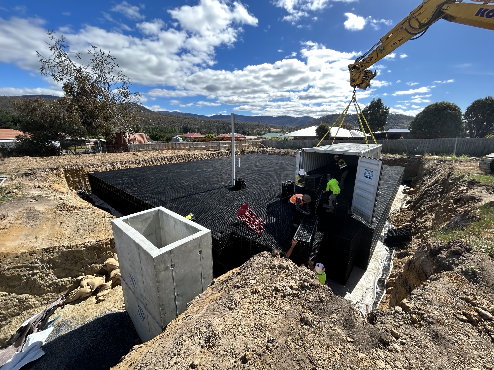 Installation of Flo-Tank underground water tank in commercial space for efficient stormwater management.